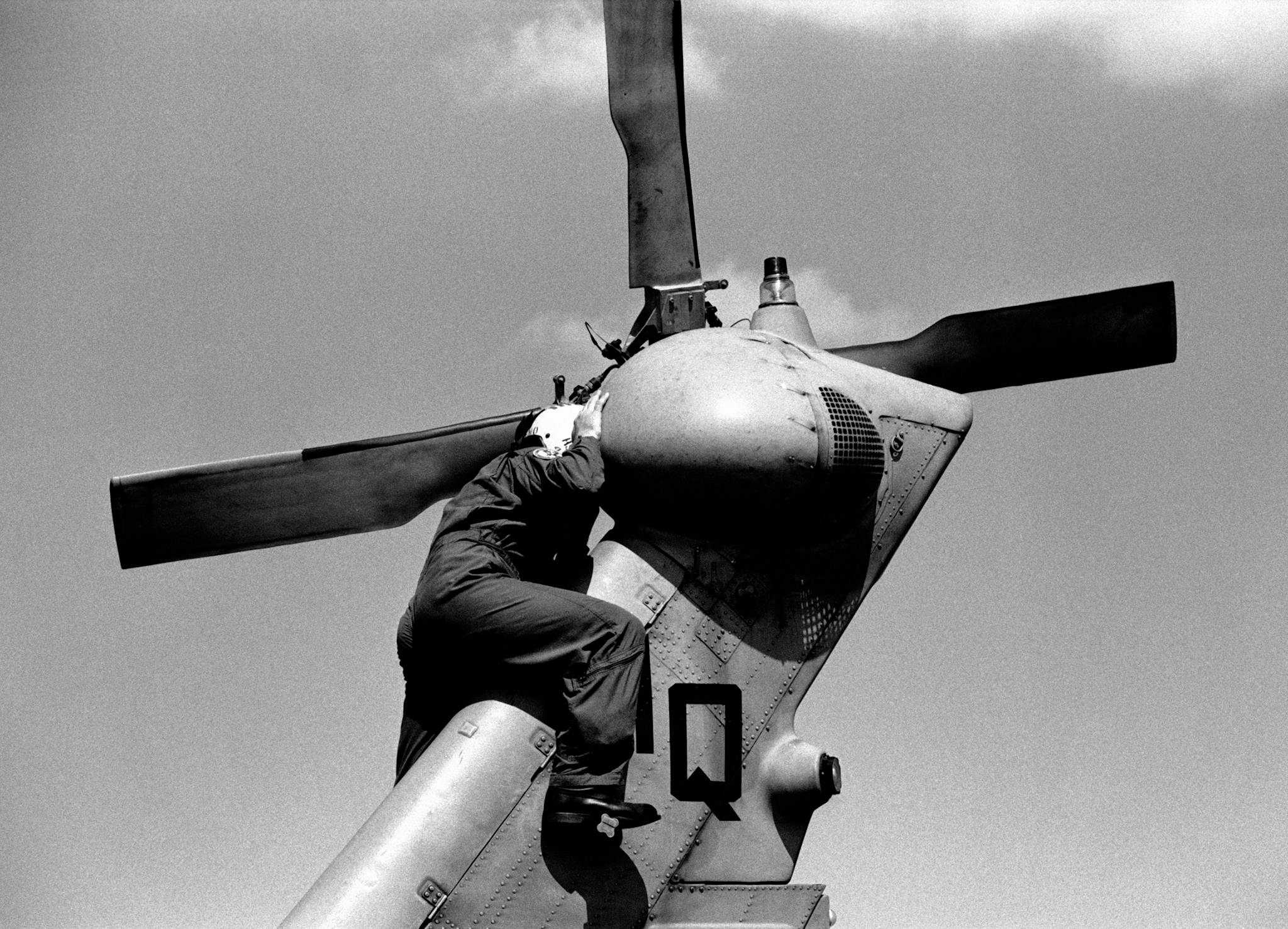 aircraft mechanic on helicopter tail